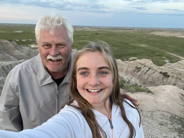 Gary smiling with family in the Badlands