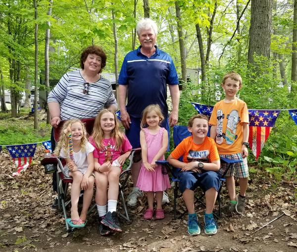 Gary with family outdoors in the woods